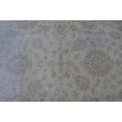 212 - Large  wool rug, beige field with foliate pattern  364 x 268cm.