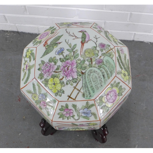 220 - A large Chinese octagonal pot and cover,  with mixed flowers and birds pattern, standing on a stylis... 