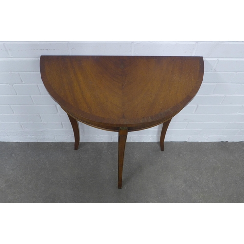 224 - Demilune consol table raised  on slender sabre legs, 61 x 70 x 31cm.