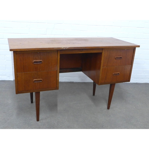 228 - Mid Century teak desk, medium size with two banks of two deep drawers, raised on tapering legs, 122 ... 