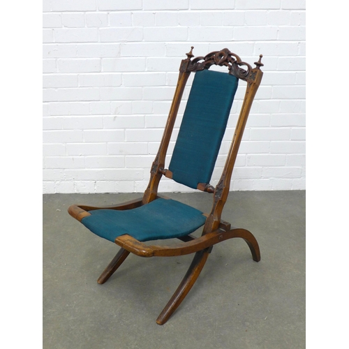 242 - Late 19th / early 20th century mahogany folding chair, with carved top rail and blue fabric back and... 