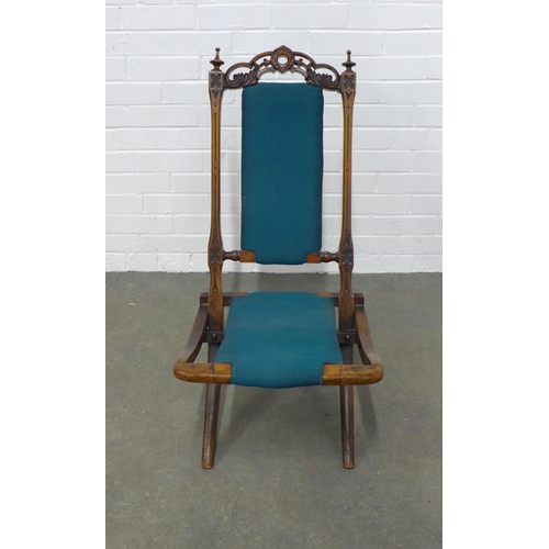 242 - Late 19th / early 20th century mahogany folding chair, with carved top rail and blue fabric back and... 