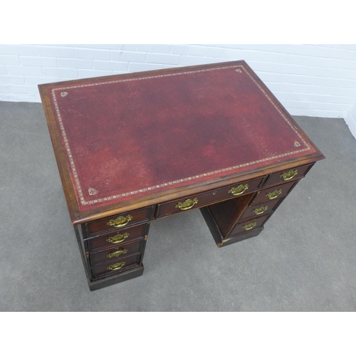 244 - Mahogany pedestal desk with red skiver top, 102 x 72 x 68cm.