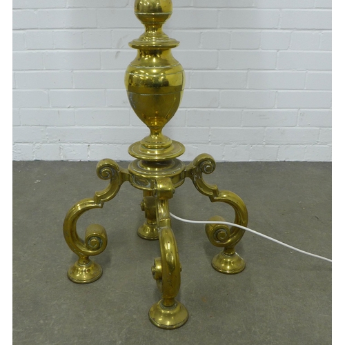 246 - A Heavy brass knop stem standard lamp, standing on four scrolling feet, complete with shade  174cm.