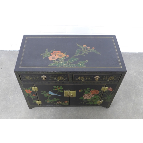 247 - Black lacquered cabinet, decorated with stylised flowers and birds,  61 x 46 x 3cm.