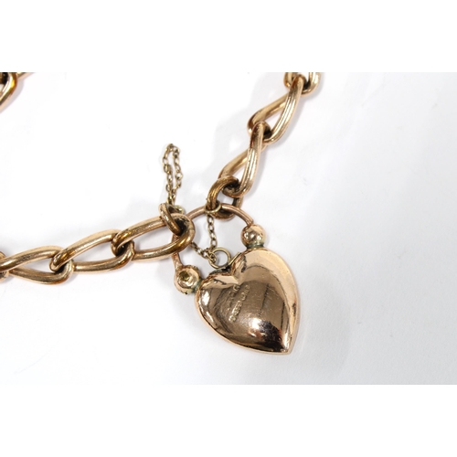 25 - 9ct gold bracelet with heart shaped padlock, inset with three jade leaf panels, Birmingham hallmarks