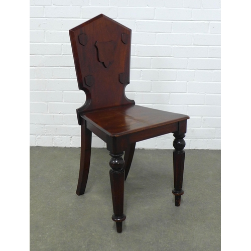 252 - Mahogany hall chair, shaped back with shield motif, solid seat and turned leg,  42 x 86 x 37cm.