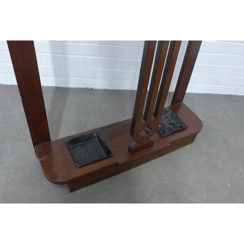 253 - An Edwardian mahogany hall stand, mirror back with six coat hooks and complete with metal drip trays... 