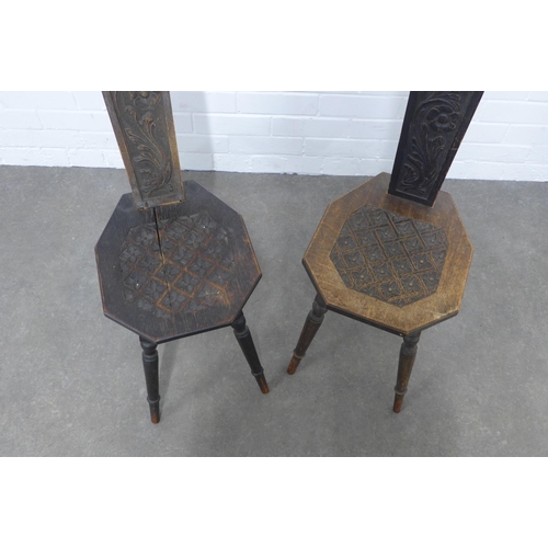 254 - Pair of spinning chairs, typical design with carved backs and seat (one is a/f) 31 x 94 x 37 cm. (2)