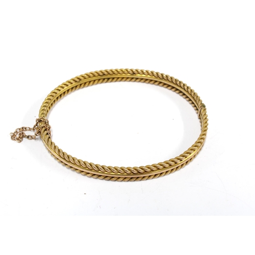 35 - Yellow metal rope twist bangle, stamped 10, together with a pair of citrine drop earrings set in unm... 