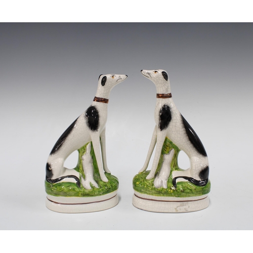 390 - Pair of Staffordshire Ware black and white dogs, 23cm (2)