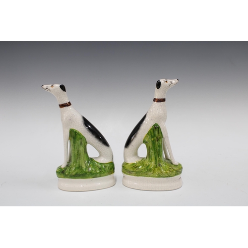 390 - Pair of Staffordshire Ware black and white dogs, 23cm (2)