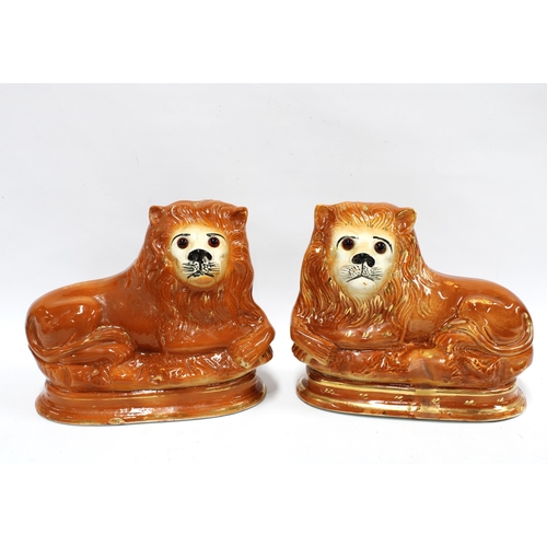 417 - Pair of Staffordshire /  Boness lions, 29 x 24cm (2)