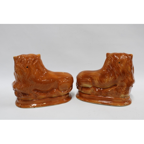 417 - Pair of Staffordshire /  Boness lions, 29 x 24cm (2)