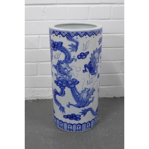 423 - Chinese blue and white dragon stick stand, 23 x 46cm.