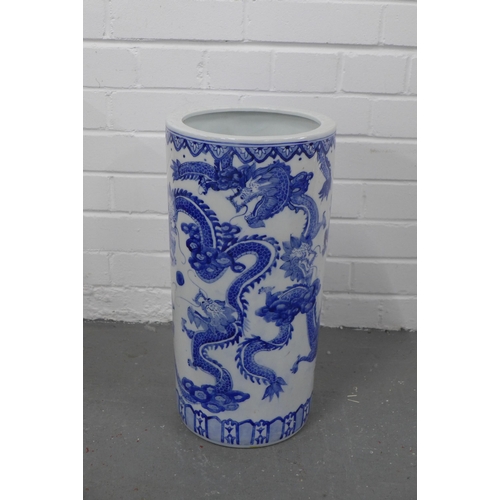 423 - Chinese blue and white dragon stick stand, 23 x 46cm.