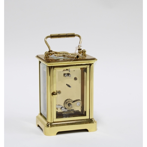 433 - Halcyon Days brass and glass cased carriage clock, with an enamel dial, 14cm including handle