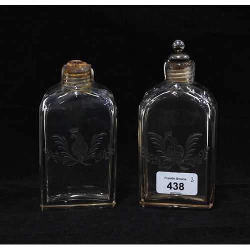 438 - A pair of late 18th century armorial engraved glass flask, one with a silver plated and cork stopper... 