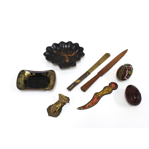 457 - Japanese bronze paper knife, two others, a small gilt metal hand paper clip, two lacquered dishes, e... 