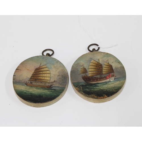 459 - A pair of small circular oil painted panels depicting sailing Junks7cm diameter (2)