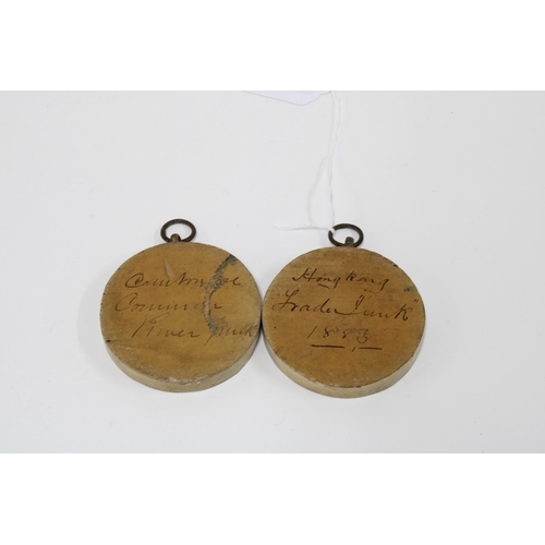 459 - A pair of small circular oil painted panels depicting sailing Junks7cm diameter (2)