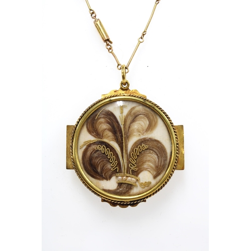 6 - 9ct gold chain with a gilt metal hair and seed mourning locket pendant