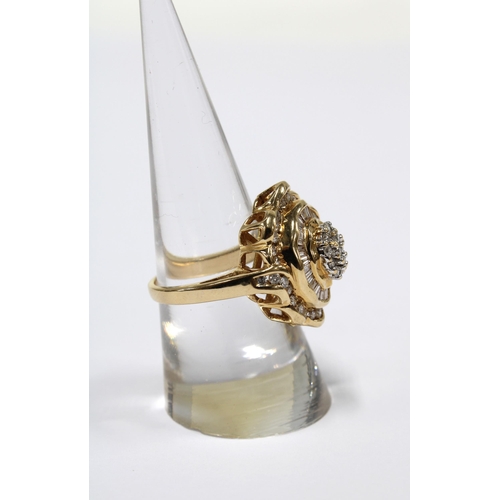 7 - 14ct gold and diamond cocktail dress ring with a flowerhead setting with a central cluster of 14 bri... 