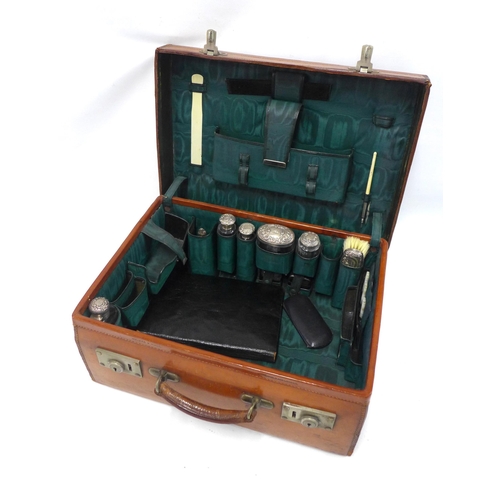 70 - An Edwardian  brown leather vanity travel case with green silk fitted interior, by Walker and Hall c... 