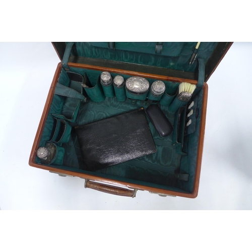 70 - An Edwardian  brown leather vanity travel case with green silk fitted interior, by Walker and Hall c... 