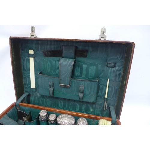 70 - An Edwardian  brown leather vanity travel case with green silk fitted interior, by Walker and Hall c... 