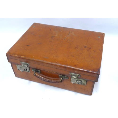 70 - An Edwardian  brown leather vanity travel case with green silk fitted interior, by Walker and Hall c... 