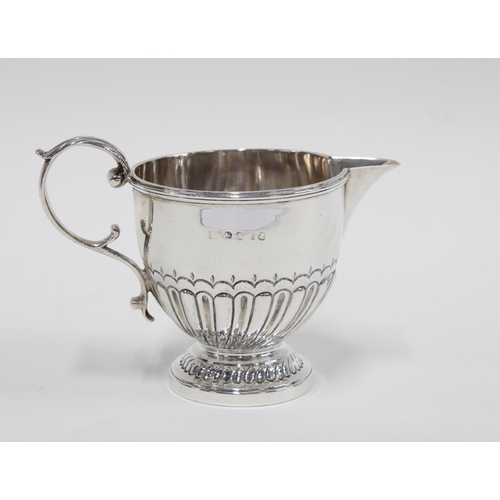 77 - Georgian silver cream jug of half fluted design, London 1814, 9cm