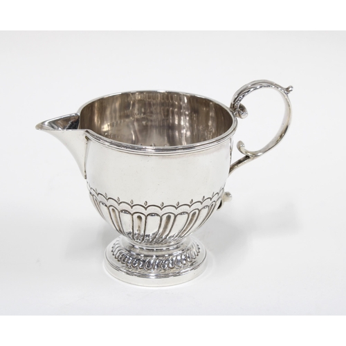 77 - Georgian silver cream jug of half fluted design, London 1814, 9cm