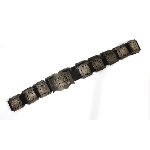 88 - An Edwardian silver belt, Birmingham 1902, with  nineteen pierced panels on a blue ribbon