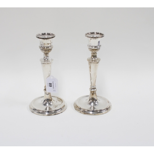 89 - A pair of silver candlesticks, (filled) Birmingham 1964, 20cm (2)