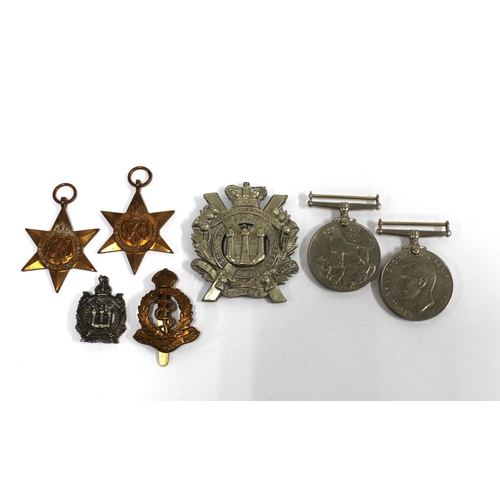 9 - WWII medals and three military badges to include Kings Own Scottish Borders, etc (7)