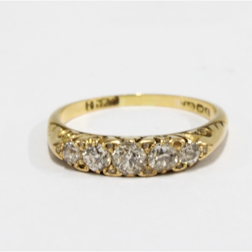 93 - 18ct gold and diamond five stone ring, with five graduating bright cut diamonds, on a pierced and sc... 