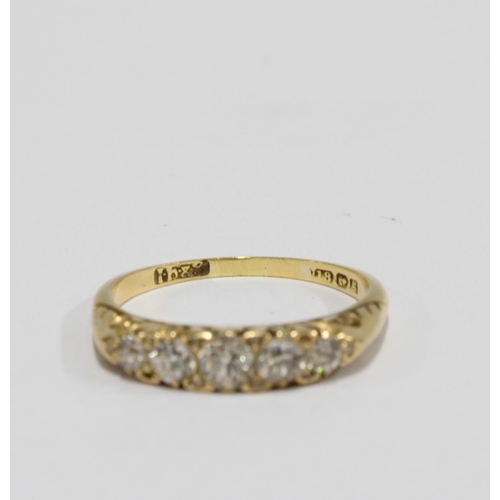 93 - 18ct gold and diamond five stone ring, with five graduating bright cut diamonds, on a pierced and sc... 