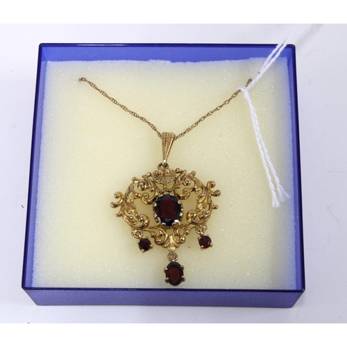 94 - 9ct gold and garnet pendant necklace, full set of hallmarks for London 1975