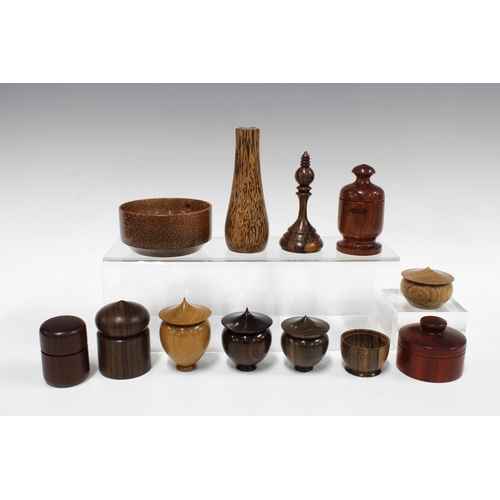 104 - A collection of artisan treen containers & vessels, woods include coconut palm, cocobolo & padauk, e... 