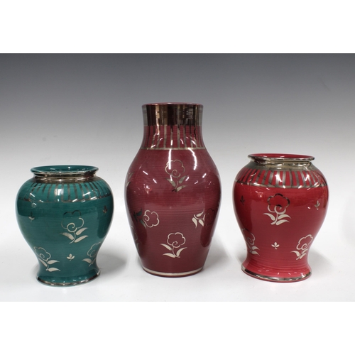 105 - Three Wedgwood Veronese vases to include two pink and one green, all with stylised silver flowers, i... 