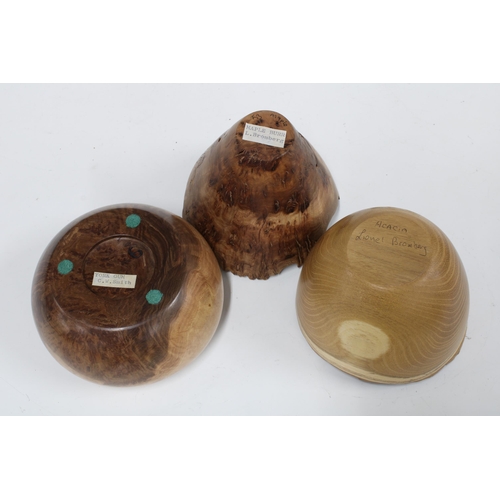 123 - Four Artisan designed wooden bowls to include acacia, gum and maple burr (4) 13cm.