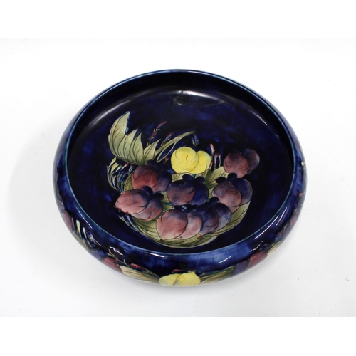 125 - WILLIAM MOORCROFT, Wisteria pattern bowl with blue ground, impressed marks and Numbered M62, 32cm. (... 