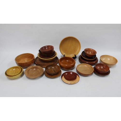 127 - A Collection of Artisan designed treen bowls and plates (24)