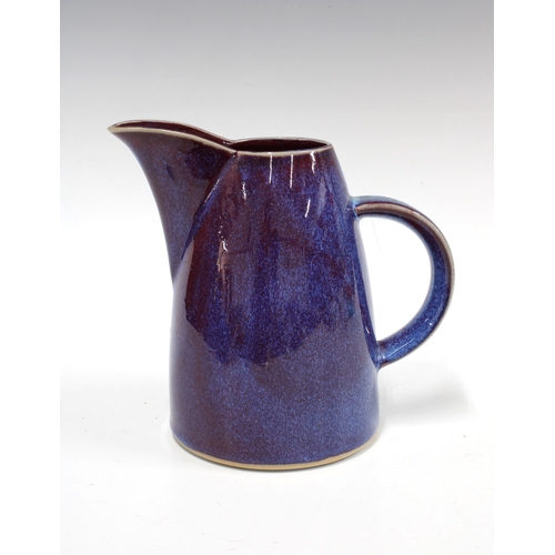 128 - Dart Pottery jug with purple hares-fur glaze, impressed mark, 22 x 18cm.