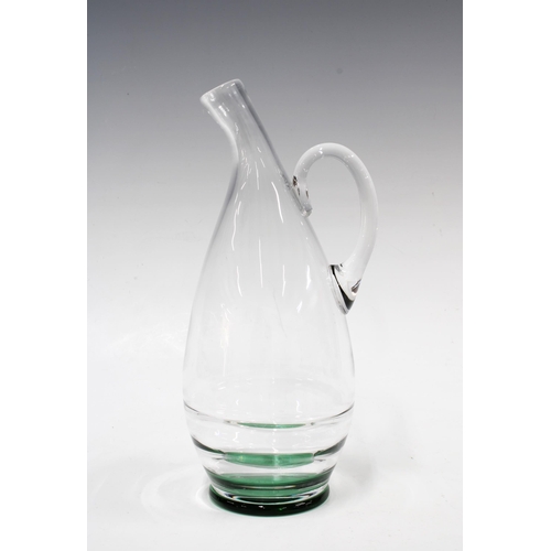 131 - ORREFORS clear art glass carafe / jug with green footrim, signed, 25.5cm high.