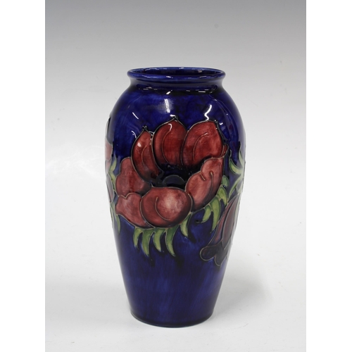 135 - MOORCROFT Anemone pattern baluster vase, impressed factory marks,  10 x 18.5cm.