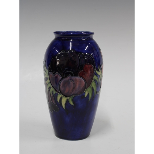 135 - MOORCROFT Anemone pattern baluster vase, impressed factory marks,  10 x 18.5cm.