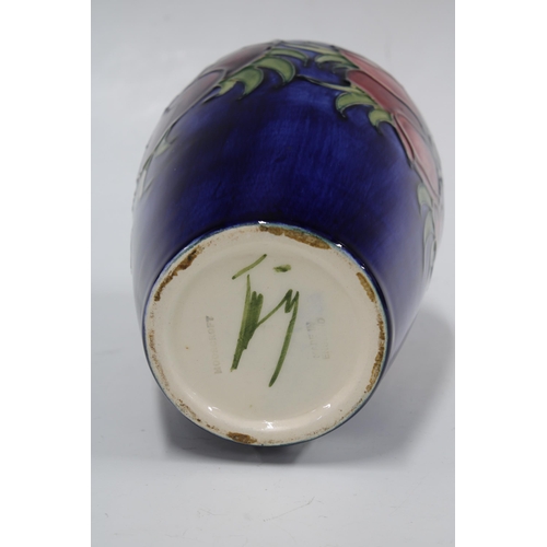 135 - MOORCROFT Anemone pattern baluster vase, impressed factory marks,  10 x 18.5cm.