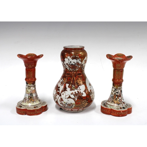 143 - Kutani double gourd porcelain vase an a pair of Kutan candlesticks, (3) 23.5cm high.